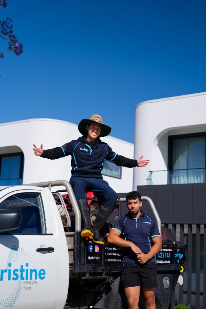 Pristine Pressure Clean team with branded service vehicle