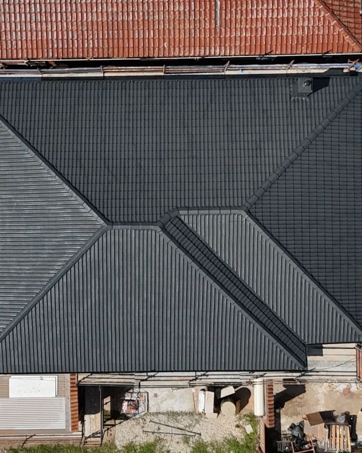 Terracotta to charcoal roof restoration in Strathfield, after